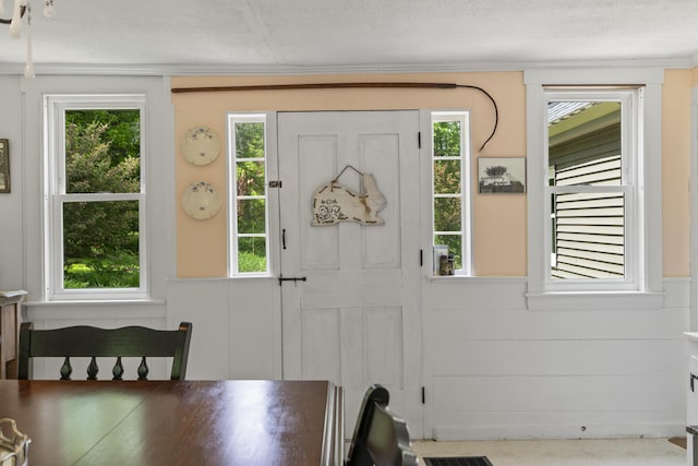 1548 Main St, Readfield, ME 04355 - entryway featuring a decorative wall, healthy amount of natural light, a textured ceiling, and wainscoting