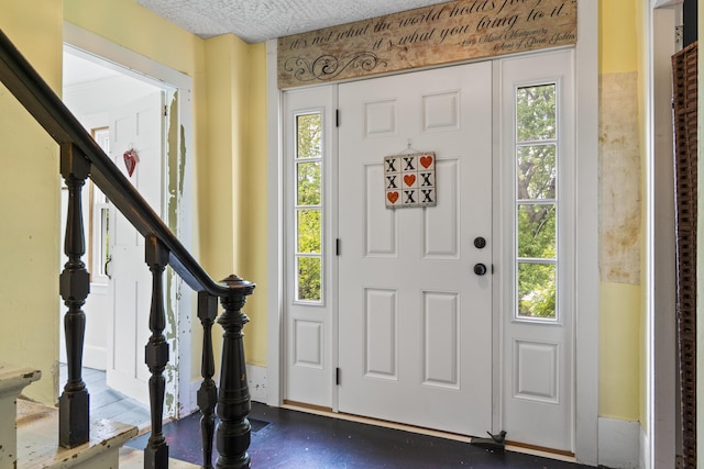 1548 Main St, Readfield, ME 04355 - foyer entrance featuring stairs and a textured ceiling