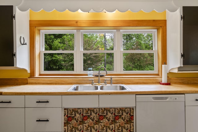 1548 Main St, Readfield, ME 04355 - kitchen featuring dishwasher, light countertops, and white cabinets