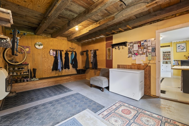 1548 Main St, Readfield, ME 04355 - below grade area with white refrigerator, wooden ceiling, and wooden walls
