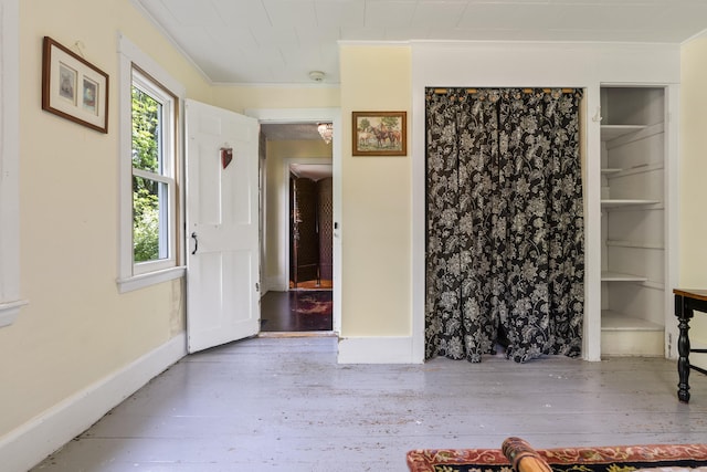 1548 Main St, Readfield, ME 04355 - unfurnished living room with crown molding, built in features, and hardwood / wood-style floors