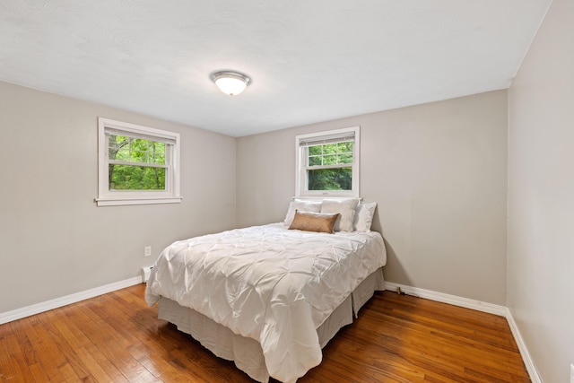267 Manchester Rd, Standish, ME 04085 - bedroom with baseboards and wood-type flooring