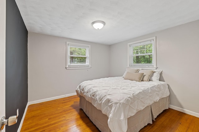 267 Manchester Rd, Standish, ME 04085 - bedroom featuring multiple windows and hardwood / wood-style flooring