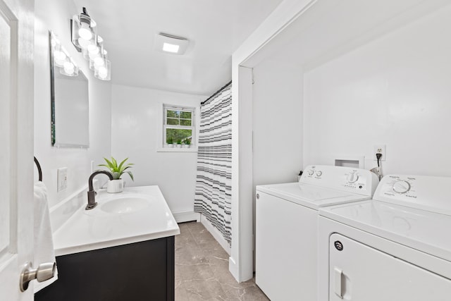 267 Manchester Rd, Standish, ME 04085 - full bathroom featuring independent washer and dryer, vanity, and marble finish flooring