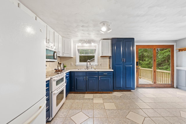 267 Manchester Rd, Standish, ME 04085 - kitchen featuring white appliances, blue cabinets, backsplash, light countertops, and healthy amount of natural light