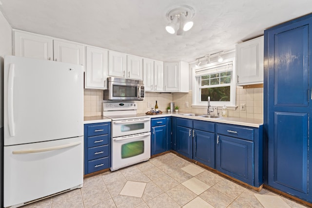 267 Manchester Rd, Standish, ME 04085 - kitchen with white appliances, light countertops, backsplash, and white cabinets
