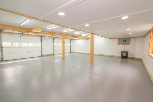 44 Donigan Rd, Moscow, ME 04920 - garage with a wood stove and recessed lighting
