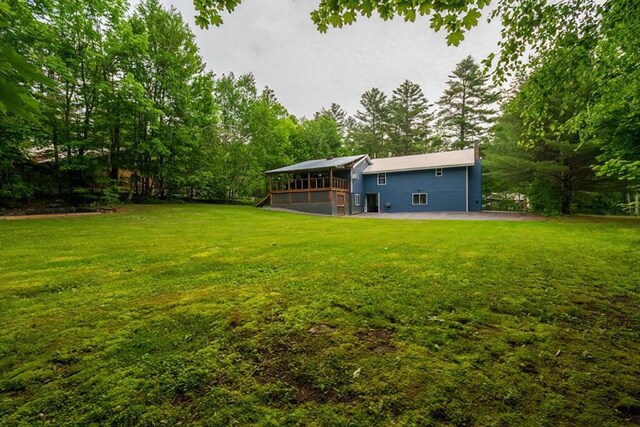 44 Donigan Rd, Moscow, ME 04920 - view of green lawn featuring a deck