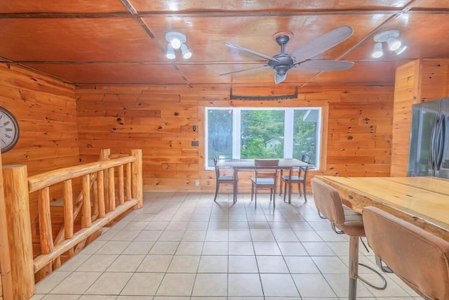 44 Donigan Rd, Moscow, ME 04920 - home office featuring a ceiling fan, light tile patterned flooring, and wood walls