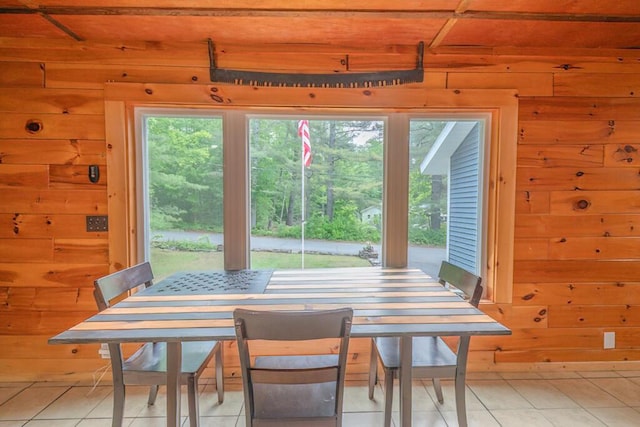 44 Donigan Rd, Moscow, ME 04920 - dining area with wooden walls and light tile patterned floors
