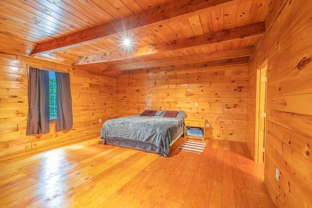44 Donigan Rd, Moscow, ME 04920 - bedroom featuring a wooden ceiling with exposed beams, wood walls, and wood-type flooring