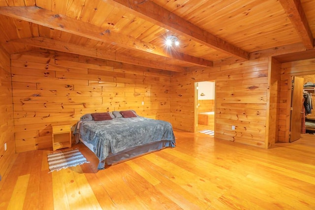 44 Donigan Rd, Moscow, ME 04920 - bedroom with wood-type flooring, a wood ceiling with exposed beams, wood walls, and connected bathroom