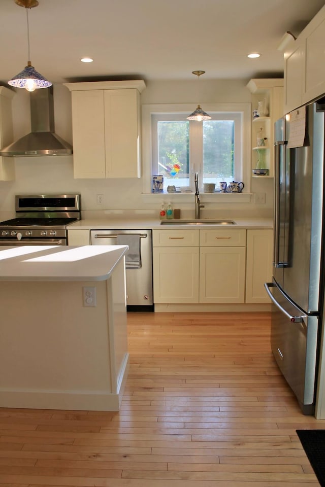 82 Tree Farm Rd, Brunswick, ME 04011 - kitchen featuring wall chimney range hood, stainless steel appliances, decorative light fixtures, light countertops, and recessed lighting