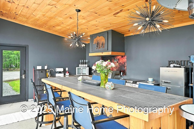 1277 Naples Rd, Harrison, ME 04040 - kitchen with a chandelier, wood ceiling, and dark countertops