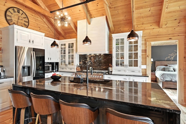 1277 Naples Rd, Harrison, ME 04040 - kitchen with stainless steel fridge with ice dispenser, wood ceiling, backsplash, glass insert cabinets, and white cabinetry