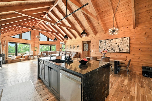 1277 Naples Rd, Harrison, ME 04040 - kitchen with dishwasher, wooden walls, light wood-style floors, open floor plan, and high vaulted ceiling