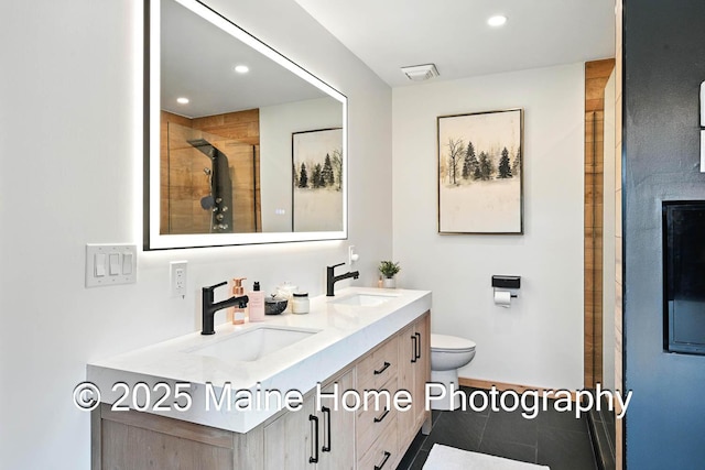 1277 Naples Rd, Harrison, ME 04040 - full bath with double vanity, a shower stall, recessed lighting, and tile patterned flooring