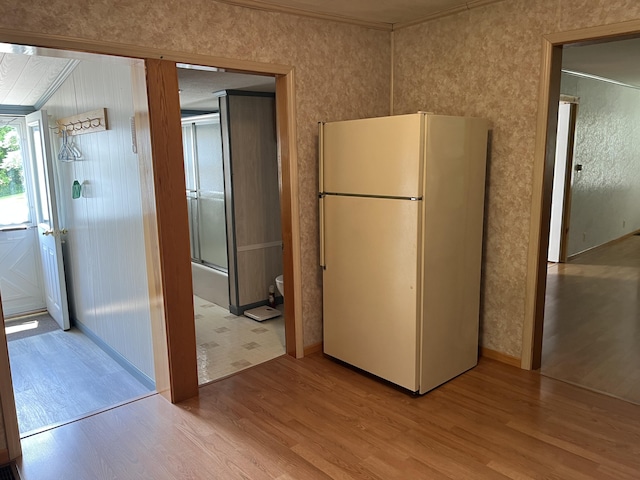 406 Cushman Rd, Winslow, ME 04901 - kitchen with freestanding refrigerator, light wood-style flooring, and crown molding