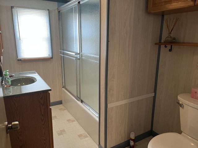 406 Cushman Rd, Winslow, ME 04901 - full bathroom featuring tile patterned floors, vanity, and bath / shower combo with glass door