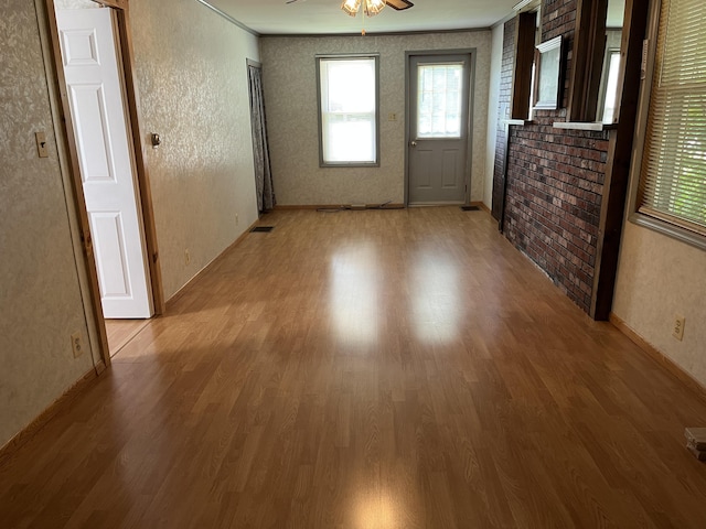 406 Cushman Rd, Winslow, ME 04901 - interior space featuring wood finished floors, ceiling fan, crown molding, and a textured wall