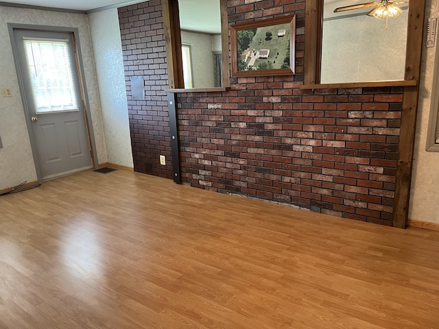 406 Cushman Rd, Winslow, ME 04901 - unfurnished living room with wood finished floors, ceiling fan, and crown molding
