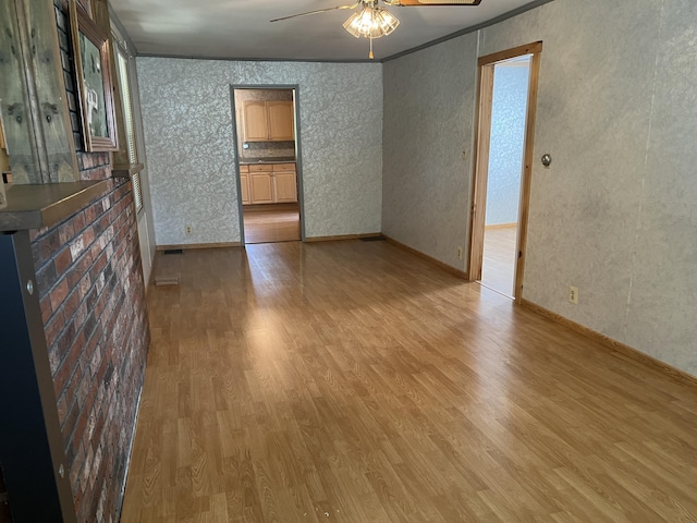 406 Cushman Rd, Winslow, ME 04901 - empty room featuring light wood finished floors, ceiling fan, and ornamental molding
