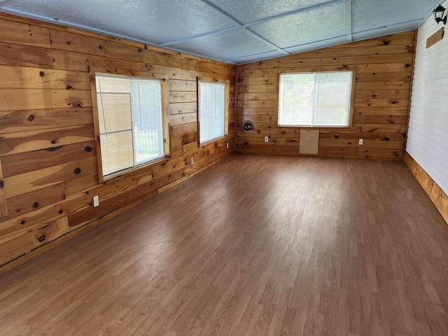 406 Cushman Rd, Winslow, ME 04901 - unfurnished room with lofted ceiling, wood finished floors, and wooden walls