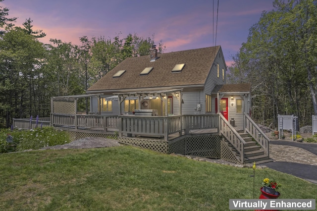 8 Holbrook Dr, Phippsburg, ME 04562 - back of property featuring roof with shingles, a yard, and a wooden deck