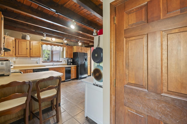 8 Holbrook Dr, Phippsburg, ME 04562 - kitchen with black appliances, a wood ceiling with exposed beams, light countertops, light tile patterned flooring, and rail lighting