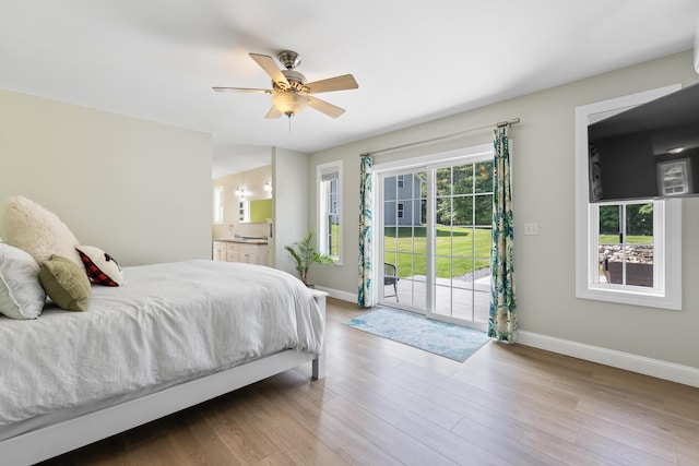 96 Frost Hill Ave, Lisbon, ME 04252 - bedroom featuring access to outside, wood finished floors, ensuite bath, and a ceiling fan