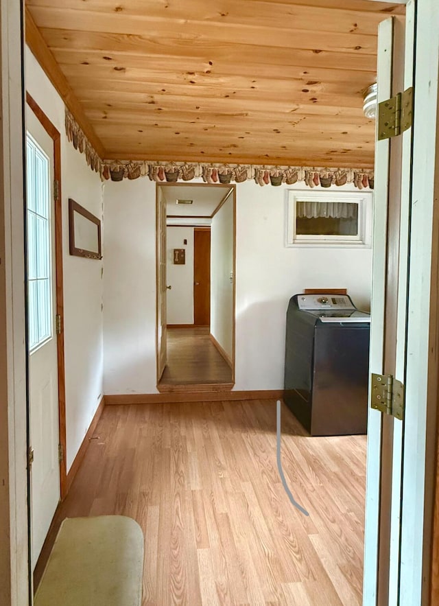 1190 Indian River Rd, Addison, ME 04606 - hall with washer / dryer, wood ceiling, and light wood-type flooring