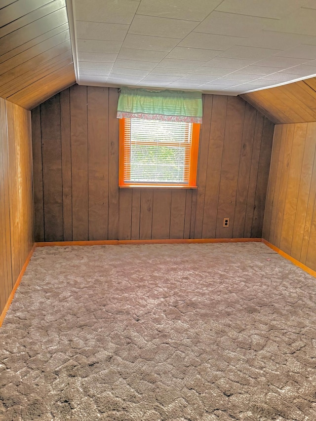 1190 Indian River Rd, Addison, ME 04606 - bonus room featuring wooden walls, vaulted ceiling, and carpet flooring