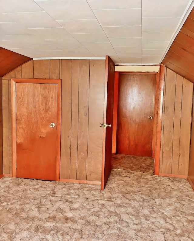1190 Indian River Rd, Addison, ME 04606 - hall featuring wooden walls, carpet, and vaulted ceiling