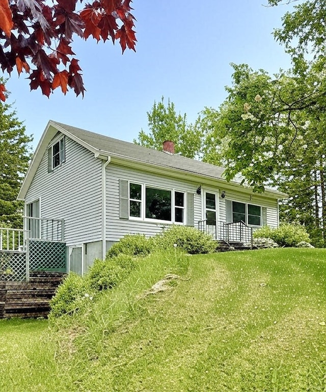 1190 Indian River Rd, Addison, ME 04606 - back of house featuring a chimney and a yard