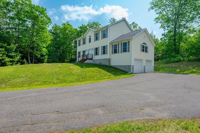 119 Somersworth Rd, North Berwick, ME 03906 - colonial home featuring an attached garage, driveway, and a front lawn