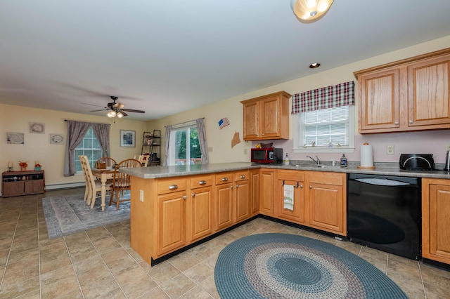 119 Somersworth Rd, North Berwick, ME 03906 - kitchen with black dishwasher, a peninsula, a ceiling fan, a baseboard heating unit, and brown cabinetry
