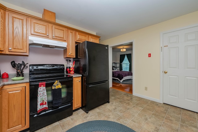 119 Somersworth Rd, North Berwick, ME 03906 - kitchen featuring under cabinet range hood, black appliances, and light countertops