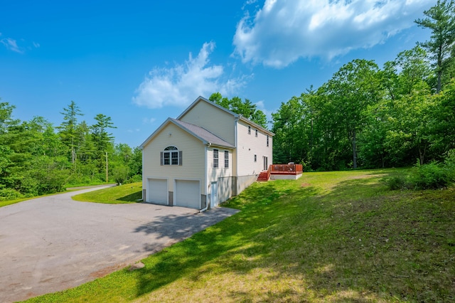119 Somersworth Rd, North Berwick, ME 03906 - view of home's exterior with an attached garage, asphalt driveway, a deck, and a yard