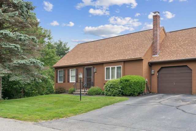 11 Concord Pl Unit 21, Auburn, ME 04210 - view of front of house with an attached garage, a front yard, driveway, a chimney, and a shingled roof