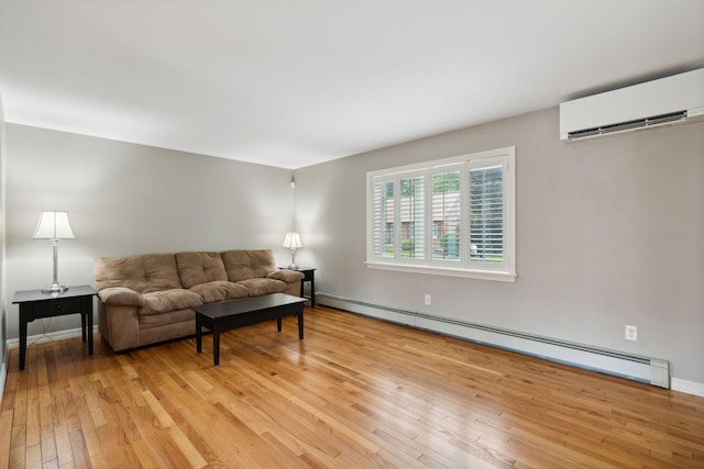 11 Concord Pl Unit 21, Auburn, ME 04210 - living area with a baseboard radiator, light wood-type flooring, and a wall mounted air conditioner
