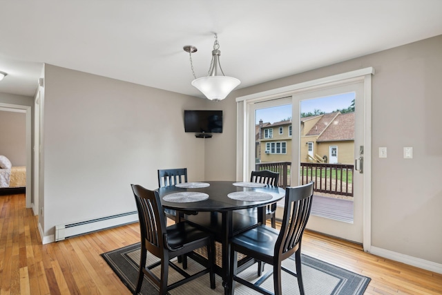 11 Concord Pl Unit 21, Auburn, ME 04210 - dining area with baseboard heating and light wood-type flooring