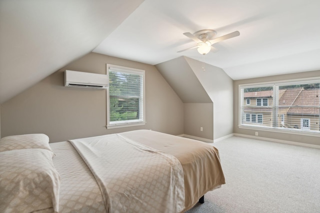 11 Concord Pl Unit 21, Auburn, ME 04210 - bedroom with an AC wall unit, light colored carpet, vaulted ceiling, and a ceiling fan