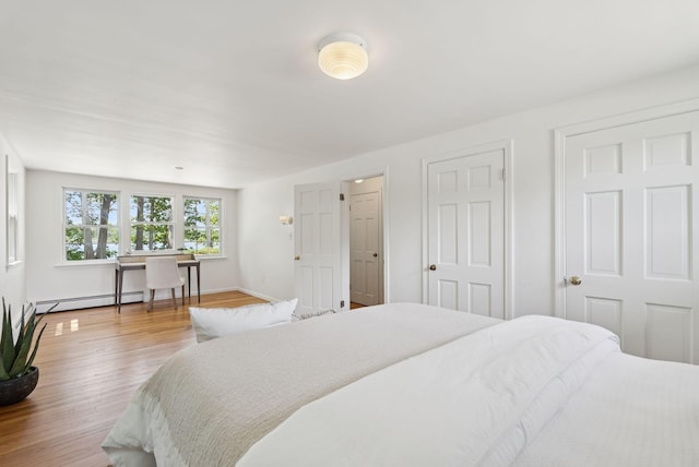 3 Tidewater Cv, Falmouth, ME 04105 - bedroom featuring a baseboard heating unit and wood finished floors