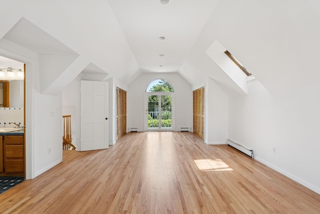 3 Tidewater Cv, Falmouth, ME 04105 - bonus room with a baseboard radiator, light wood finished floors, baseboard heating, and lofted ceiling