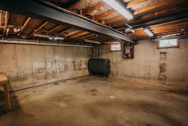 41 Curtis Ln, Milford, ME 04461 - basement with oil tank and healthy amount of natural light
