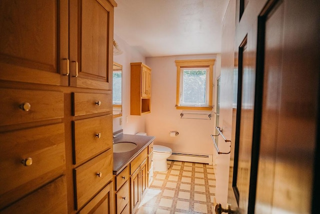 41 Curtis Ln, Milford, ME 04461 - full bath featuring baseboard heating, tile patterned floors, and vanity