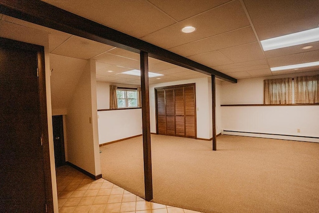 41 Curtis Ln, Milford, ME 04461 - basement featuring baseboard heating, light carpet, recessed lighting, a drop ceiling, and light tile patterned floors