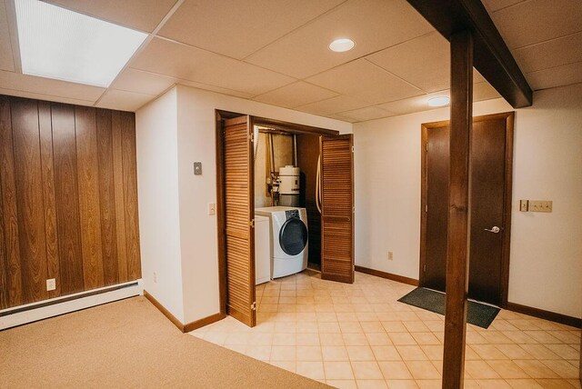 41 Curtis Ln, Milford, ME 04461 - laundry area with baseboard heating, washer and dryer, and wooden walls