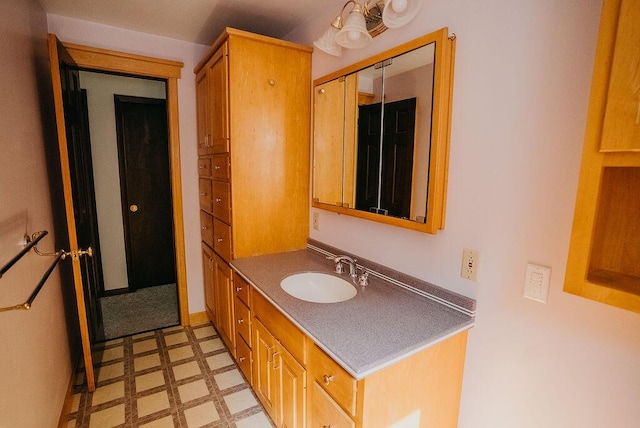 41 Curtis Ln, Milford, ME 04461 - bathroom with tile patterned floors and vanity