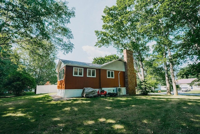 41 Curtis Ln, Milford, ME 04461 - back of house with a chimney